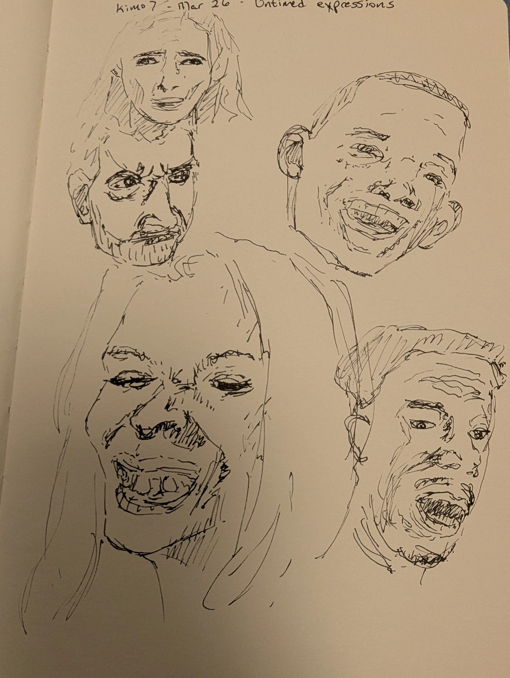 5 faces with drawn with a pen